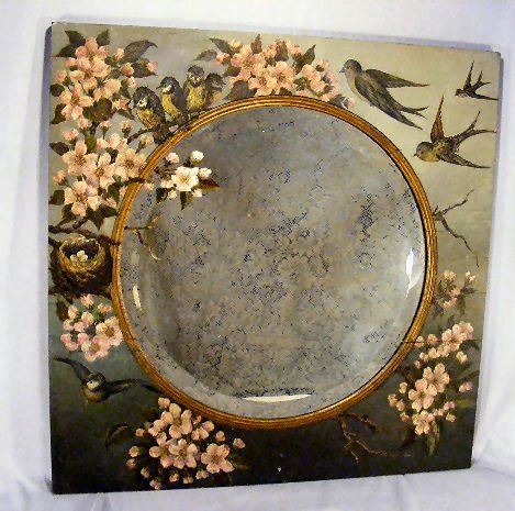 Victorian wall mirror with hand painted frame with: Victorian wall mirror with hand painted frame with bluebirds and dogwood blossoms, 25" X 25", some splits on board surround, beveled mirror with spotting