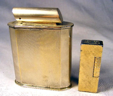2 lighters. 1 Dunhill Rollalite lighter, engraved: 2 lighters. 1 Dunhill Rollalite lighter, engraved Loni-Don 1946-1966 on top. Large table top lighter, mark on bottom.
