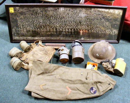 WWI military lot, 2 gas masks (fabric is hard/bri: WWI military lot, 2 gas masks (fabric is hard/brittle), jacket (some moth damage), helmet, 2 strops, bandages & ribbons. Watch fob. Framed military photo 4' x 17" of 301st Engineers 76th Division, Col