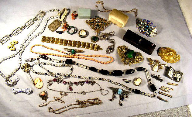 Costume jewelry lot, Deco glass necklace, rhinest: Costume jewelry lot, Deco glass necklace, rhinestone necklace, garnet ring (1 stone is out, but in ring box), pins, Crown Trifari butterfly pin, cameo, bracelet, coral beaded necklace, Moorish figural