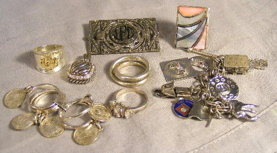 Lot of sterling silver jewelry including marcasit: Lot of sterling silver jewelry including marcasite buckle, pendant, chain with charms, rings, 3 troy oz. with stones