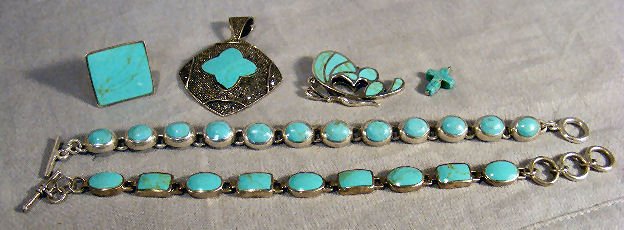 Lot of sterling and turquoise jewelry including t: Lot of sterling and turquoise jewelry including two necklaces, cross pendant, butterfly pendant, square ring and marcasite pendant with chip on stone, 2.97 troy oz. total weight