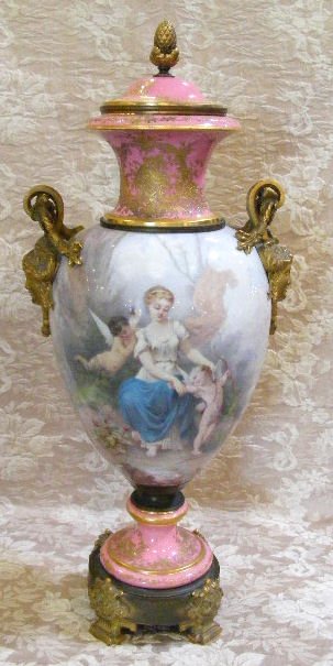 Monumental 19th C. Sevres urn with bronze ormolu: Monumental 19th C. Sevres urn with bronze ormolu, intricate hand painted around entire body, 34" high, artist signed, some wear to gilt on ormolu, no chips, cracks or repair to porcelain, surface scra