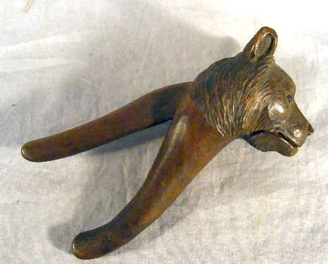 German black forest carved bear nutcracker, one g: German black forest carved bear nutcracker, one glass eye replaced with black bead, 7" long