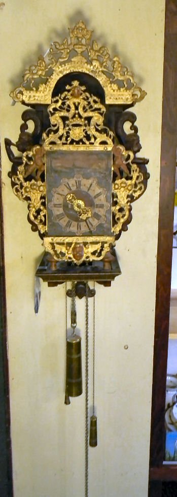 18th. Century Dutch bracket clock, hand painted d: 18th. Century Dutch bracket clock, hand painted dial face surrounded by iron decoration, one carved mermaid carving with broken arm (plaster repair), brass works, case measures 27"