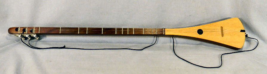 Strum stick guitar, labeled inside and signed "Bob (1 of 6)