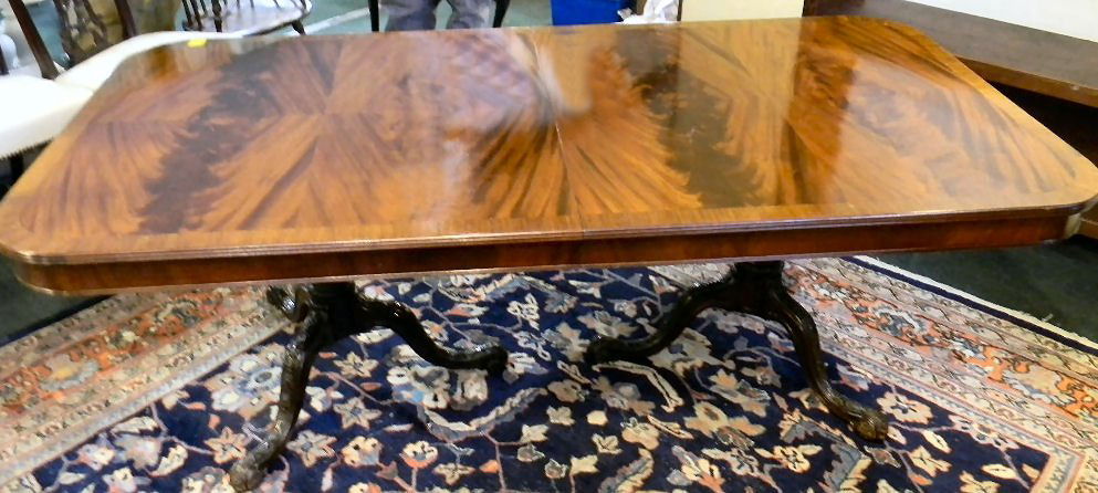 Fine quality mahogany dining room table, double c: Fine quality mahogany dining room table, double carved pedestals and flame mahogany veneer, top measures 84" X 42". Extends with three 24" leaves. Leaves scratched