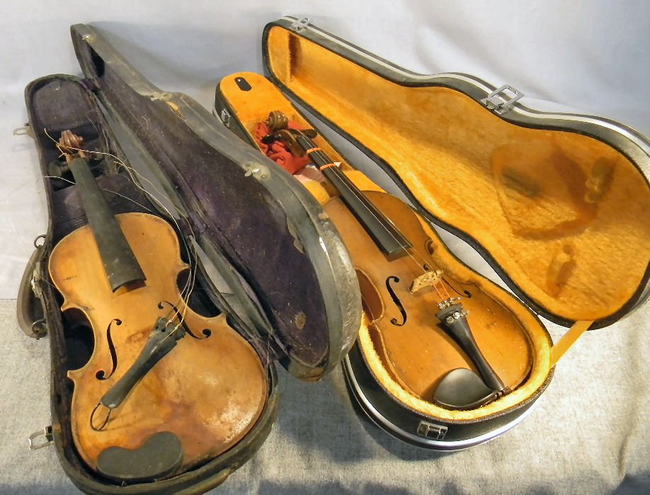 Two violins, each as is, one labeled "Chas. Farle: Two violins, each as is, one labeled "Chas. Farley, Boston and other labeled "Made in Japan" on orange lined case