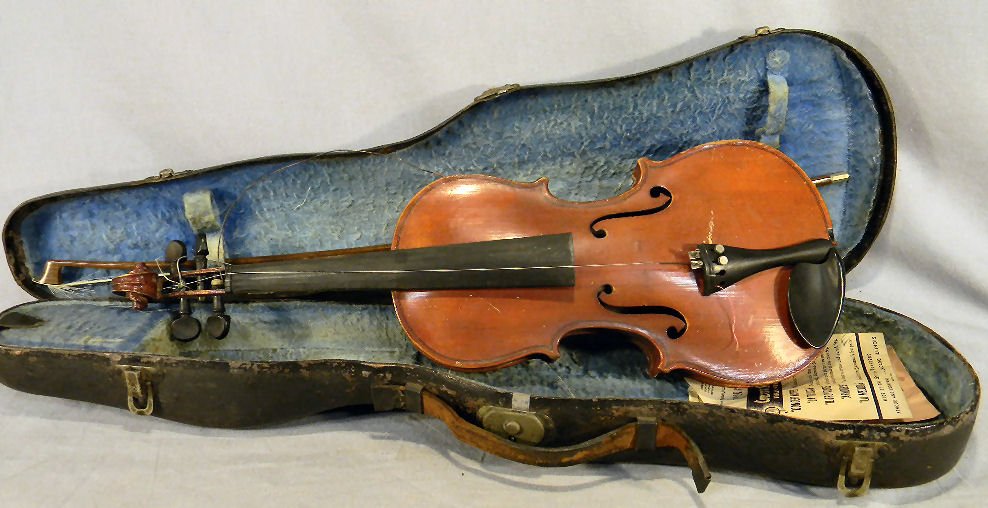 Estate violin, 22" long labeled "Antonio Stradiva: Estate violin, 22" long labeled "Antonio Stradivarius Made in Czecho-Slovakia", scratches and scuffs, no cracks, bow marked "Germany" only