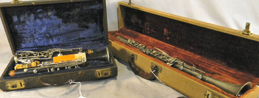 Two estate clarinets, Selmer Signet (incomplete) : Two estate clarinets, Selmer Signet (incomplete) and Rene Duval, made in Italy, dent on end, sold "as is"