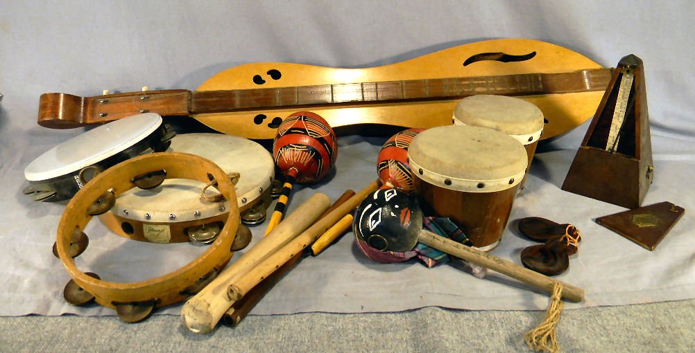 Misc lot of musical instruments including and unm: Misc lot of musical instruments including and unmarked dulcimer, castanets, bongo, tambourines, maracas and metronome