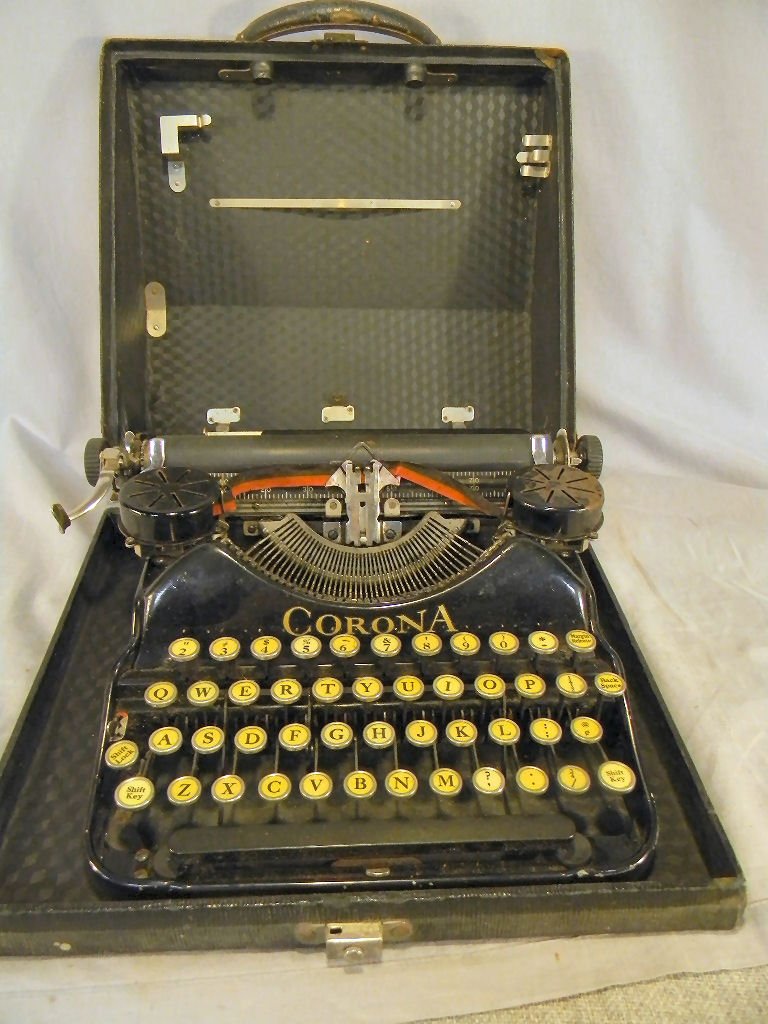Corona typewriter, paint worn from rear lower edg: Corona typewriter, paint worn from rear lower edge, sold "as is", case rough
