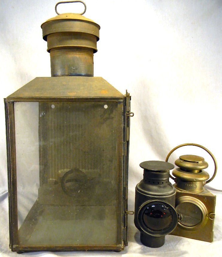 Lot of three lanterns, Dietz, brass Veena and lar: Lot of three lanterns, Dietz, brass Veena and large tin lantern with one glass pane missing