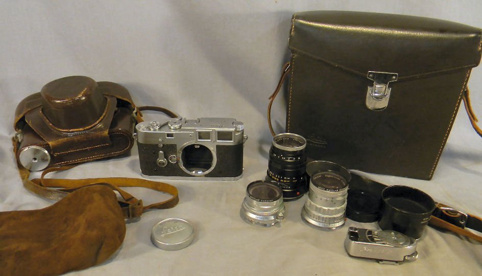 Leica Camera M3-735319, 3 Leitz Wetzlar Germany l: Leica Camera M3-735319, 3 Leitz Wetzlar Germany lenses and operational, cosmetic covering back of camera torn. Two lenses need cleaning appears to be no fungus or mold.