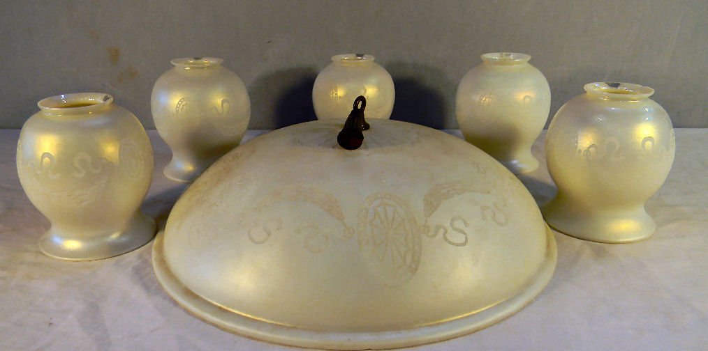 Set of Steuben etched Ivrene lamp shades for hangi: Set of Steuben etched Ivrene lamp shades for hanging lamp fixture, five 5" lamp shades 2.25" fitter edge, three have chips on fitter edge, all are marked with Steuben silver mark, 14" shade with shall