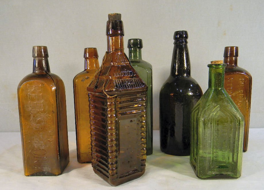 Lot of bottles including St. Drakes 1862 log cabin: Lot of bottles including St. Drakes 1862 log cabin bottle, two Reeds Tonic, Chief Wahoo Electric Tonic, Hostetters Stomach Bitters, etc. No chips or cracks on any