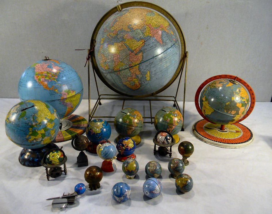 Lot of tin globes most from the mid 20th century,: Lot of tin globes most from the mid 20th century, two of the globe banks are Chein, also includes pencil sharpeners and other banks. Last globe pictured is heavily dented