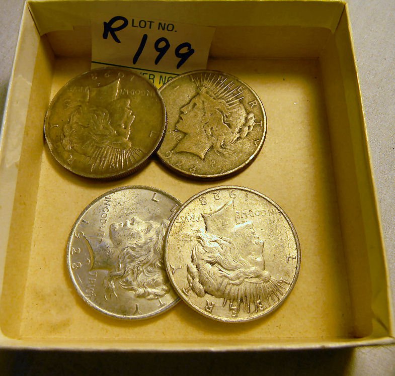 Four circulated Peace silver dollars, 1923: Four circulated Peace silver dollars, 1923