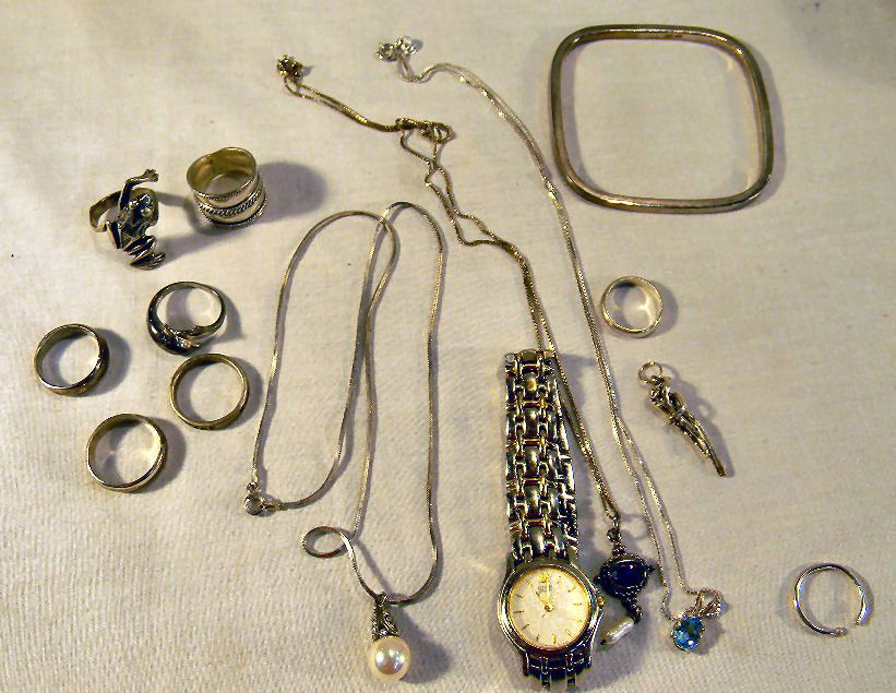 Lot including sterling silver rings, figural pend: Lot including sterling silver rings, figural pendant, three pendants on chains, bracelet, etc. weighing 1.69 troy oz. together with ladies Citizen Elegance quartz watch
