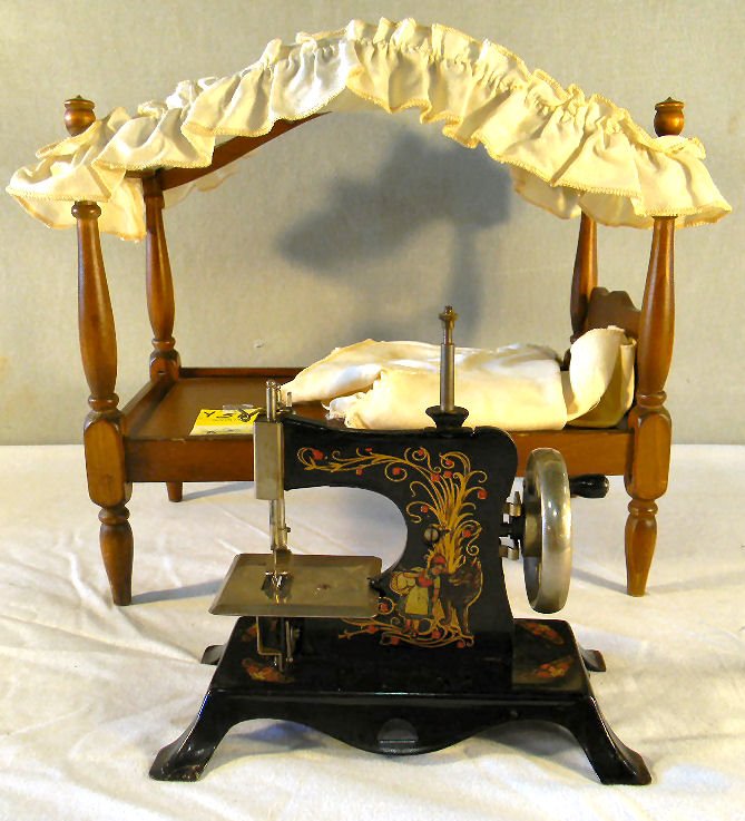 Child's sewing machine, Little Red Riding Hood, marked : Child's sewing machine, Little Red Riding Hood, marked "Made in Germany together with doll bed