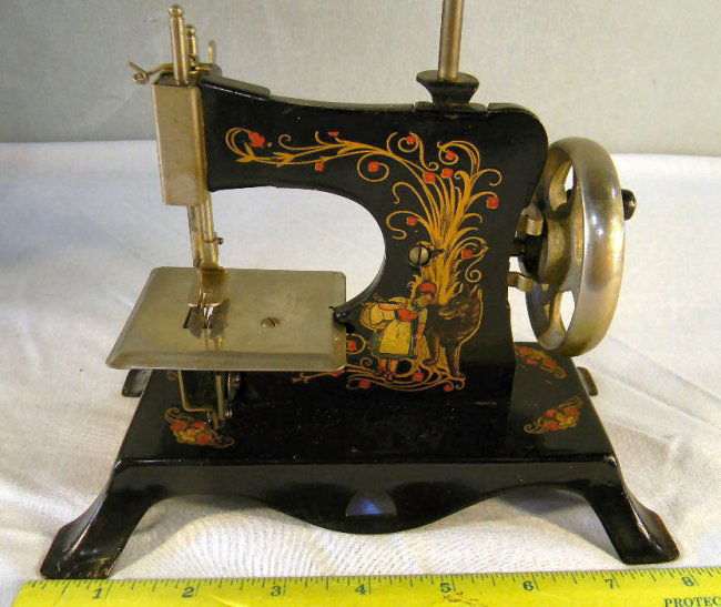 Child's sewing machine, Little Red Riding Hood, marked Lot 51Y