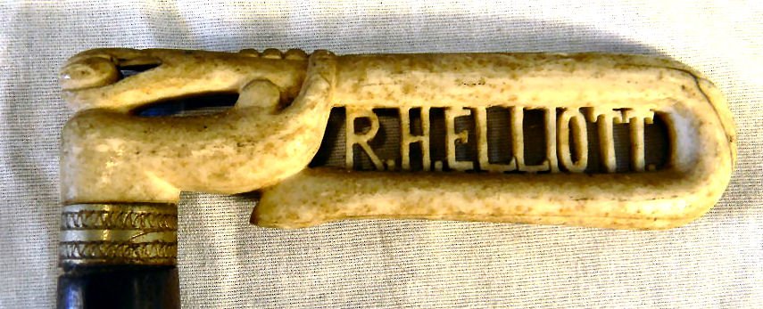 Bone handled cane/walking stick, carved handle with han: Bone handled cane/walking stick, carved handle with hand, snake with apple, name R.H. Elliot, 34.5" long, stress line on end of handle