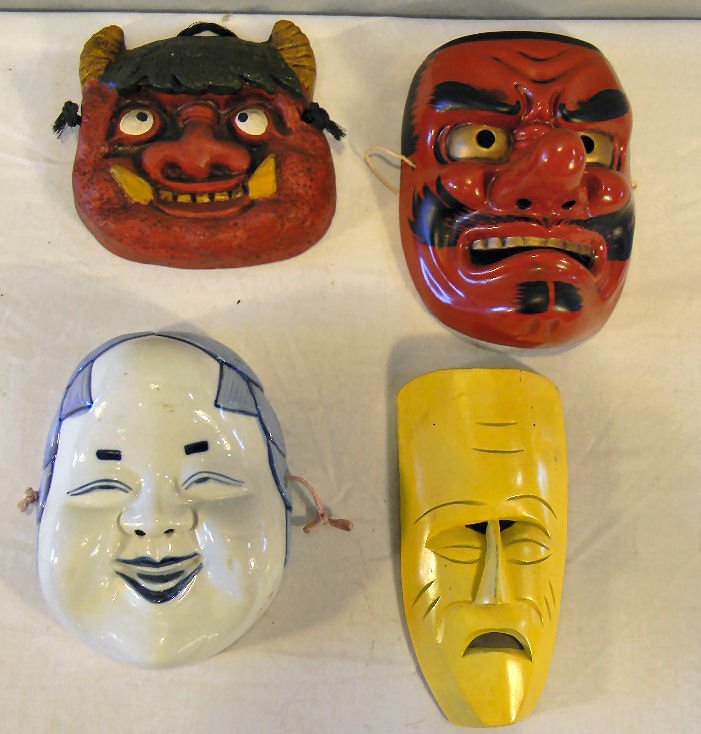 Four Kabuki masks, two are pottery, one porcelain and y: Four Kabuki masks, two are pottery, one porcelain and yellow wood mask