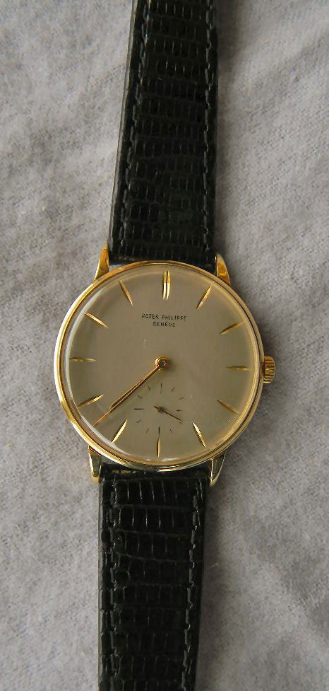 Estate Patek Philippe 18K yellow gold wristwatch, clean: Estate Patek Philippe 18K yellow gold wristwatch, cleaned and in good running order, original dial, engraving removed from back, new band & buckle, 1.25" dial