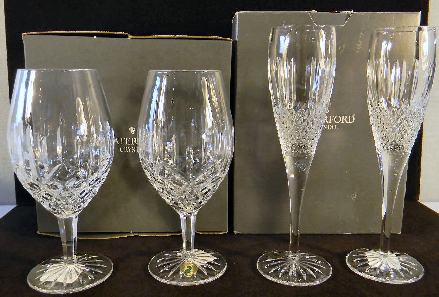 Two Waterford crystal ice beverage glasses together wit: Two Waterford crystal ice beverage glasses together with two Glenmede flutes, all mint in box.