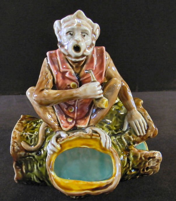 German majolica figural monkey on log cigar/cigarette h: German majolica figural monkey on log cigar/cigarette holder with match holder and striker, 7" high, 6" long, no chips or cracks