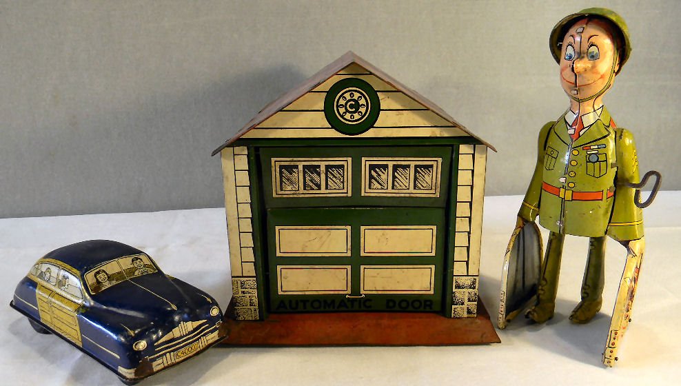 Courtland Walt Reach tin Automatic Door garage, very go: Courtland Walt Reach tin Automatic Door garage, very good condition with some soiling, scuffs & scratches, Unique Art G.I. Joe tin wind-up toy in working order and Courtland Walt Reach friction automo