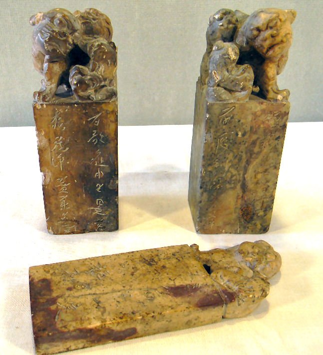 Three Chinese soapstone chop seals, 6.5" high, chips on: Three Chinese soapstone chop seals, 6.5" high, chips on some bottom and side edges, carved foo dog tops