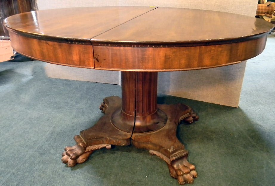 Claw foot split column dining room table: Claw foot split column dining room table, 48" diameter with five 8" leaves, table is refinished, leaves not refinished