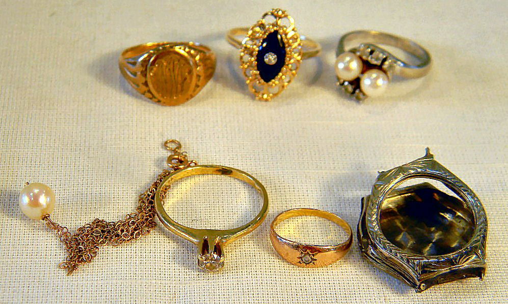 Scrap gold lot - 3 10K gold rings, 9.8 grams total weig: Scrap gold lot - 3 10K gold rings, 9.8 grams total weight including stones and 14K watch case, chain, and two rings (one with diamond) weighing 6 grams total