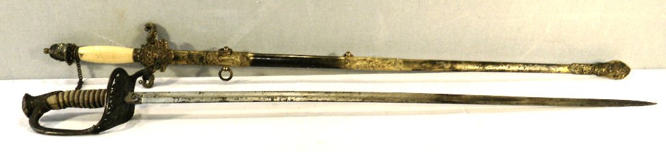Two swords - U.S. Navy sword, no scabbard, blade bent w: Two swords - U.S. Navy sword, no scabbard, blade bent with rust, rusted point, grip good handle loose & Pettibone Odd Fellows sword, finish on scabbard worn, surface rust on blade, handle loose