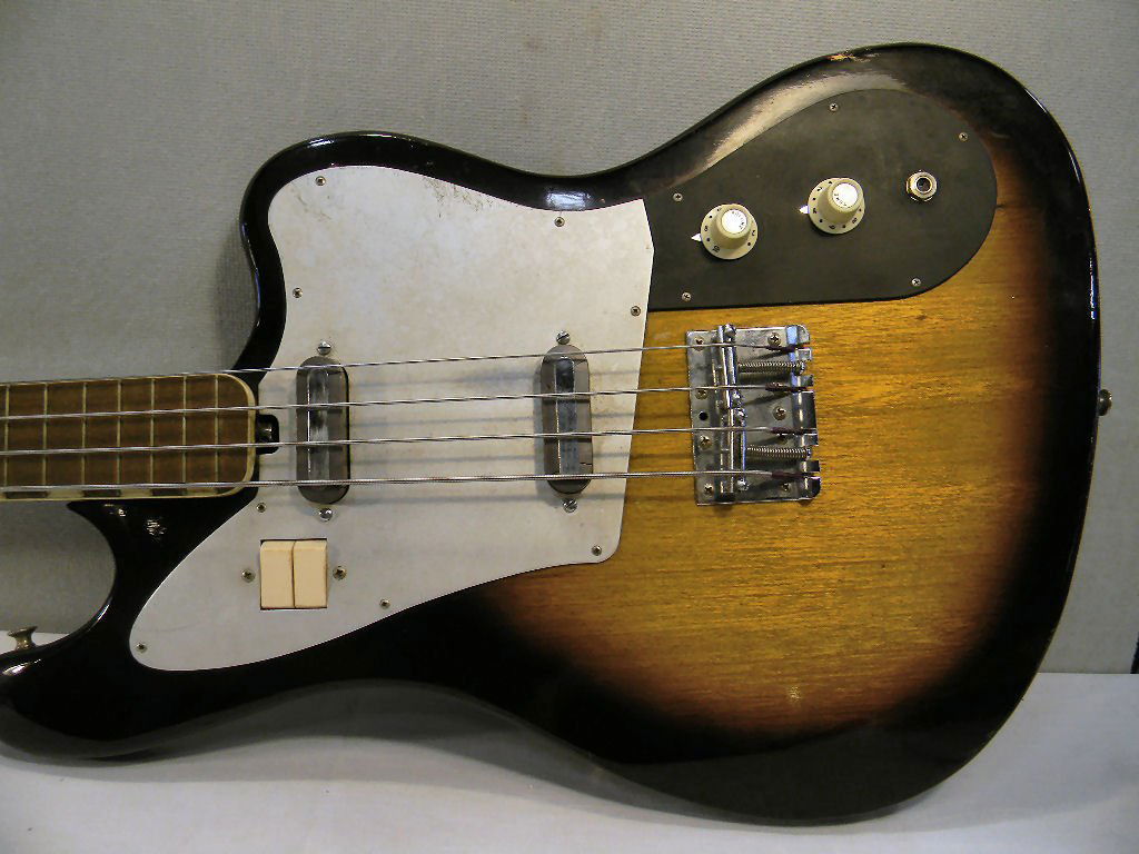 1960's electric bass guitar with soft case, one tuning : 1960's electric bass guitar with soft case, one tuning key missing, finish good with some scuffs/scratches, nick on edge photographed, no maker identification