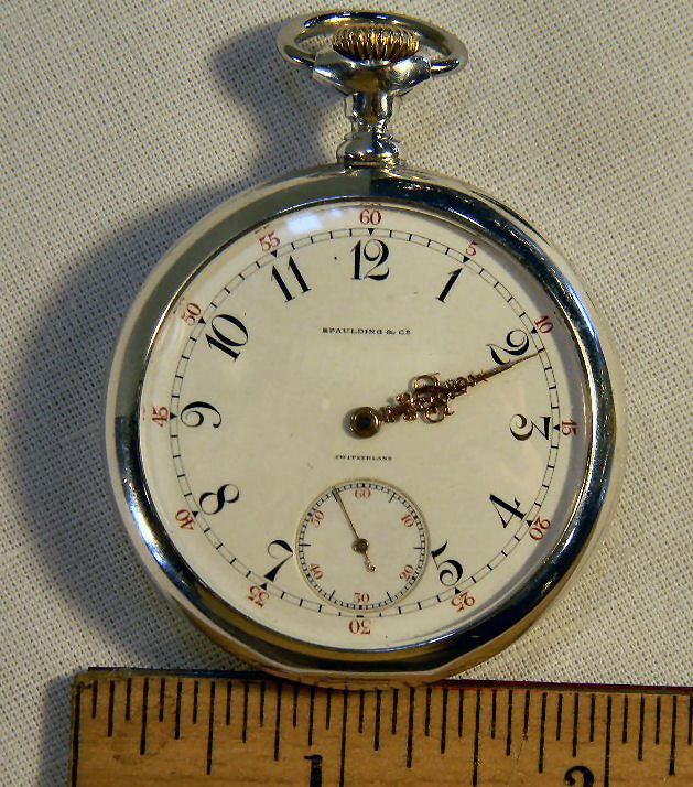 Patek Philippe pocket watch with Fahey sterling silver : Patek Philippe pocket watch with Fahey sterling silver case, 21 jewel movement #153522, pat. Number 1891, running order, back of case monogrammed, just short of 2" diameter. Marked Spaulding & Co. on