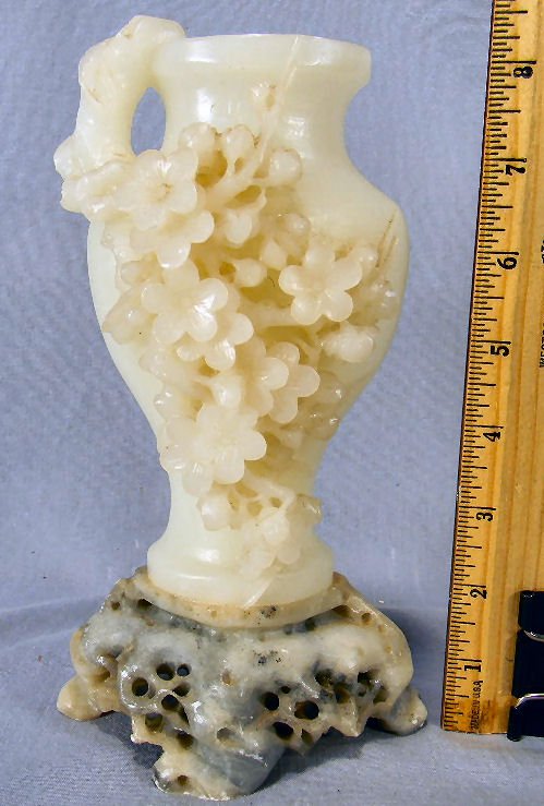 Asian soapstone carved vase on base, nicely carved with: Asian soapstone carved vase on base, nicely carved with prunus flowers, 8.25" high, very minor flicks