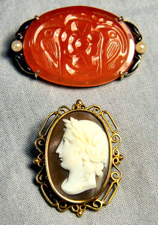 Two cameos with 14K frames, one shell cameo pendant/bro: Two cameos with 14K frames, one shell cameo pendant/brooch and one carved glass or stone cameo with pearls. No cracks to cameos.