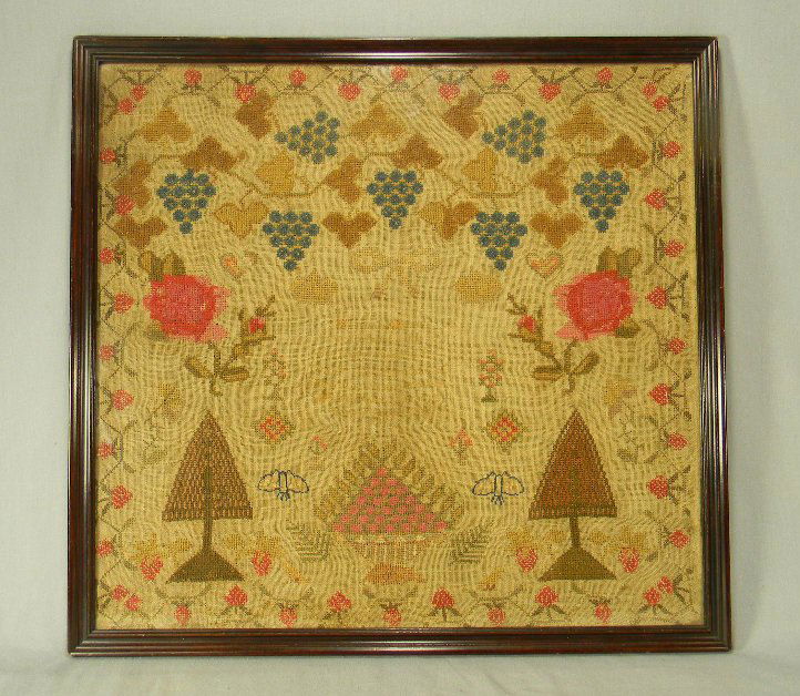English needlework sampler by Hannah Quin, message in: English needlework sampler by Hannah Quin, message in center is faded, information on back states that is was completed in 1824, 19.5" X 18.25"