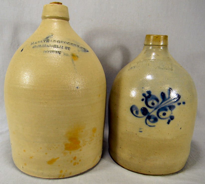 Two stoneware jugs, one with cobalt decoration: Two stoneware jugs, one with cobalt decoration impressed "New York Stoneware Co.", 11.5" high with no capacity mark, two gallon jug impressed "Mass. Tea & Grocery Co. 49. 51. 53. & 55 Elm St. Boston",