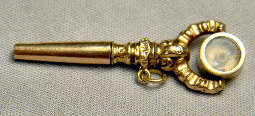 Ornate 14K gold pocket watch key with compass, 3 grams: Ornate 14K gold pocket watch key with compass, 3 grams total weight, 1 5/8" long, excellent condition