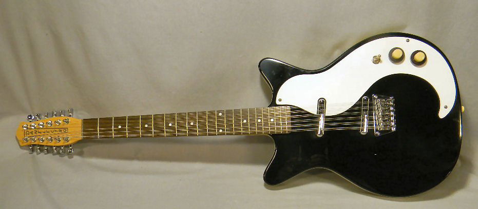 Danelectro electric guitar, made in Korea, 12 string: Danelectro electric 12 string guitar, made in Korea, 39.5" long, 13.5" wide, very good condition, with soft case