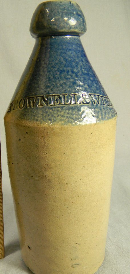Brownell & Wheaton 1873 impressed stoneware bottle with: Brownell & Wheaton 1873 impressed stoneware bottle with cobalt decoration, 10" high, no chips, cracks or hairlines, lettering strong