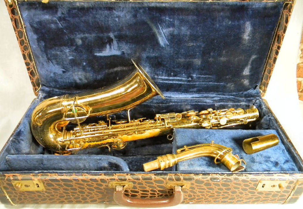 Estate Conn, Elkhart, Ind., saxophone, tarnished, no: Estate Conn, Elkhart, Ind., saxophone, tarnished, no breaks, small dent on back center, sold "as found". Numbered A 24204 L