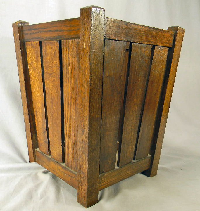 Mission oak arts & crafts wastebasket: Mission oak arts & crafts wastebasket, original finish which may or may not have been top coated, removable bottom warped, chips on top edge, 16.25" high, 12" square at top