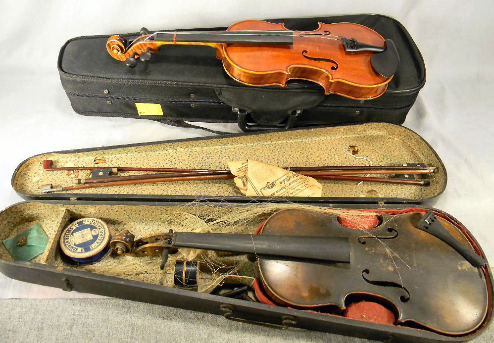 Two violins, unlabeled antique violin: Two violins, unlabeled antique violin with chips on edges, no breaks or cracks, with wood case, 23.25" long, sold as is together with Peccard Model V-8, size 3/4, copy of Antonio Stradivari, dated 200