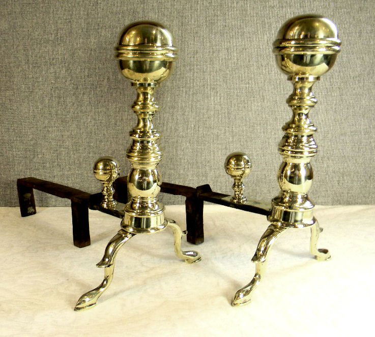 Pair of period brass andirons with iron dogs: Pair of period brass andirons with iron dogs, very good condition with very minor dings, polished, 22" long and 16" high