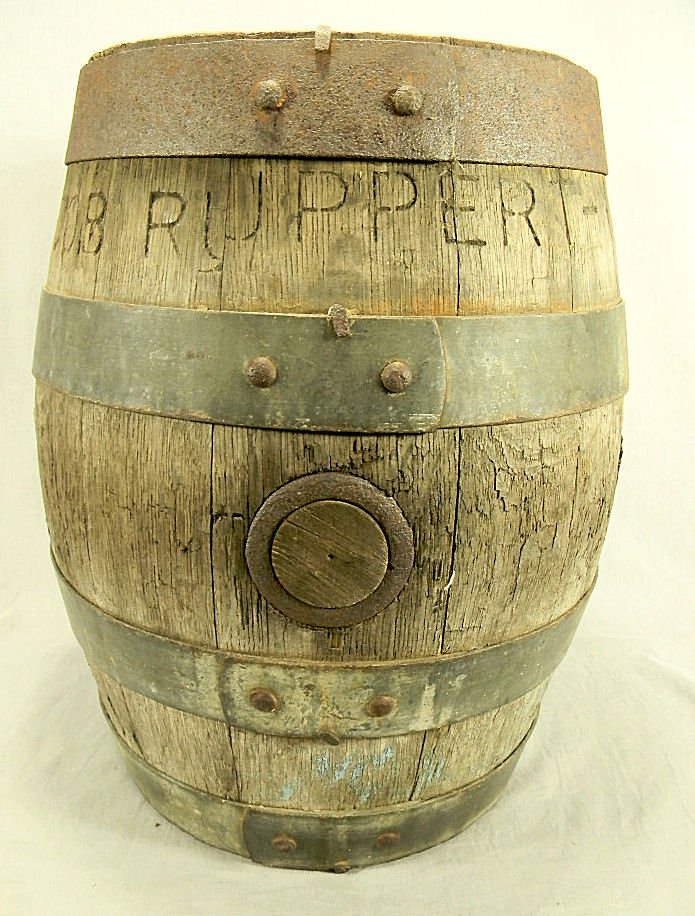 Antique Jacob Ruppert wooden beer keg: Antique Jacob Ruppert wooden beer keg with riveted metal bands, 16" high, 13" wide