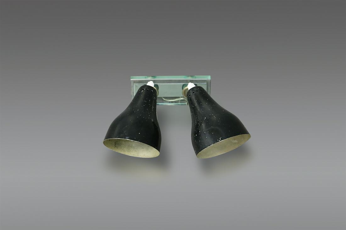 Wall Lamp Angelo Ostuni Black Midcentury for Oluce: Wall sconce designed by Angelo Ostuni for Oluce in 1960. The light is composed of 2 lights their cap is in painted aluminium conical shaped. The light is anchored to the wall by a thick glass sheet. D